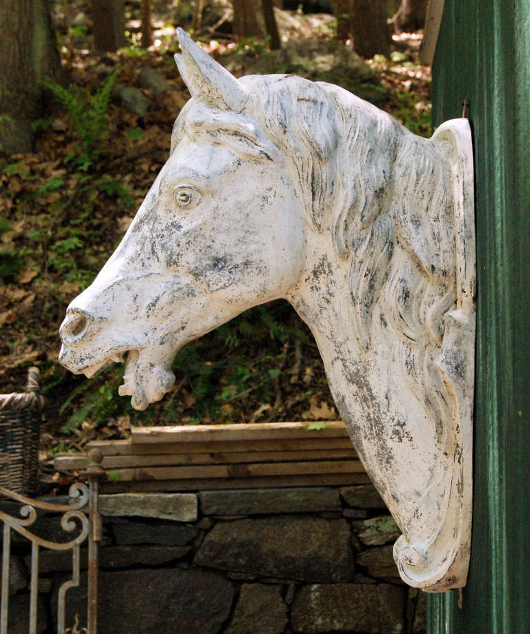 This cast zinc horse's head would have graced the stables on a grand estate, or a horse supply store, such as a saddle shop. 

Stamped at the base, J. W. Fiske / 26 & 28 Park Place / New York.  Fiske was at this address from 1874-1892 and the