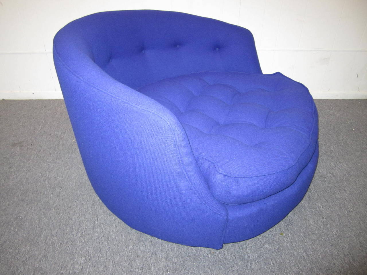 Gorgeous Milo Baughman circular swivel lounge chair.  This piece retains it's original blue wool woven fabric in very good condition.  You will love the style and comfort of this modern classic masterpiece.