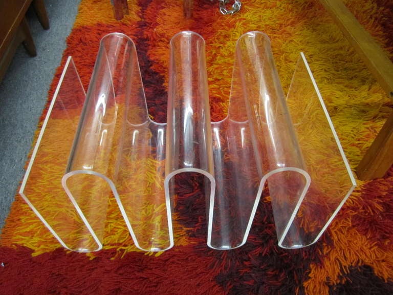 Very unusual and large lucite squiggle pop style magazine rack.  Wow this piece is over the top fabulous.  This is the 1st one of these i have ever seen so i believe it be quite rare.  i have a large selection of lucite magazine racks in my other