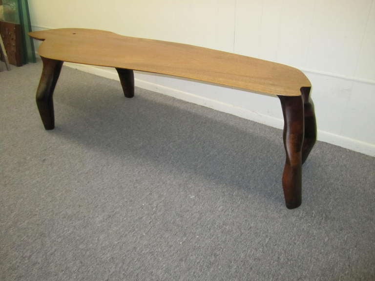 Fabulous American craftsman carved free edge walnut bench.  I sure wish i could find a signature on this unusual one of a kind bench-that would make describing this piece a bit easier.  I think this carved piece looks like a crawling creature- look
