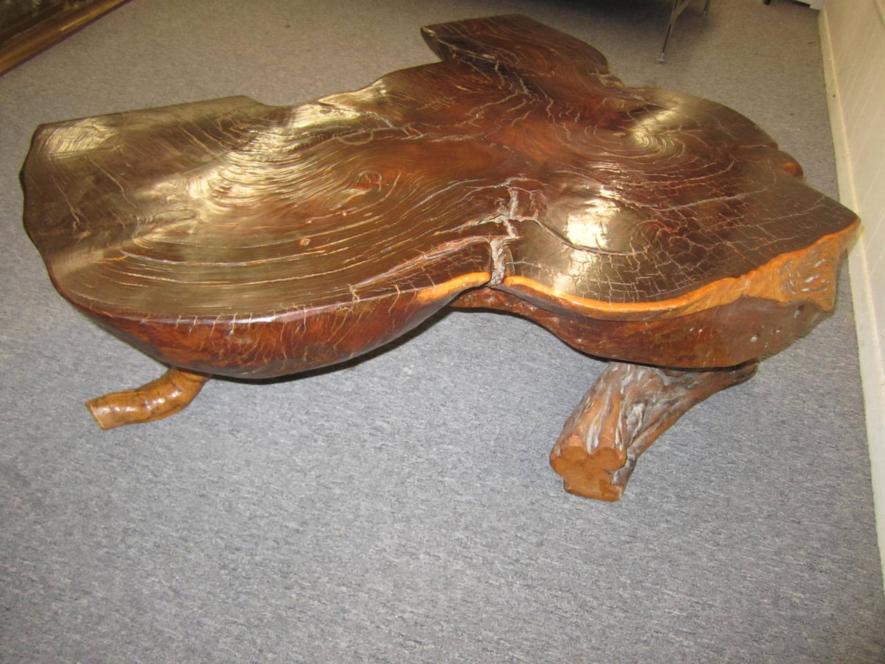 Wonderful organic redwood thick slab coffee table.  Adds fabulous organic texture to just about any style room.  We have had one in our own home for years and love it with all my super modern pieces of furniture.