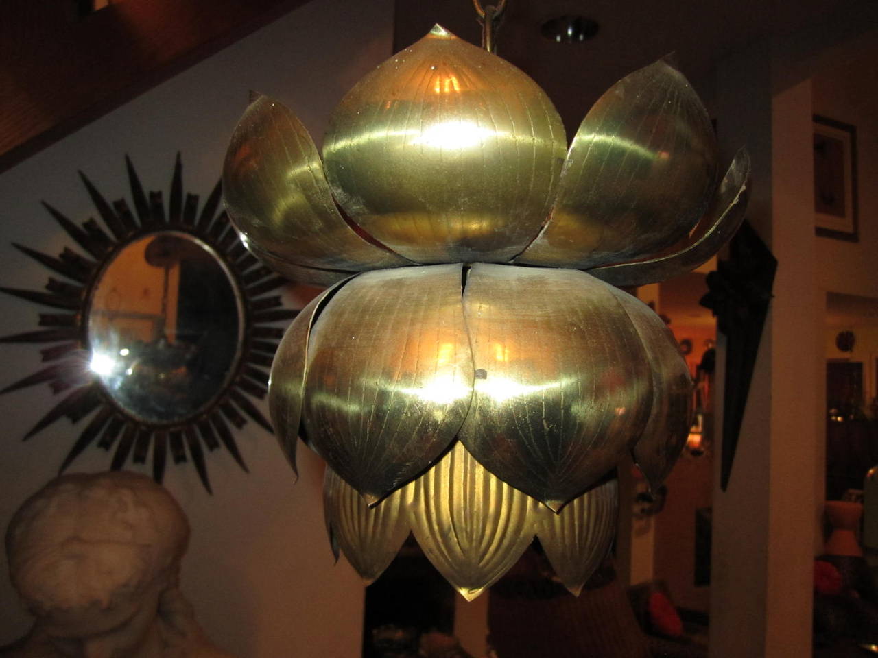 Long a symbol of purity, beauty and rebirth this lotus shaped brass pendant light is an enlightened addition to your home. Great in a hallway, entrance way or swanky powder room. High styled mood lighting for any spot that needs some vintage