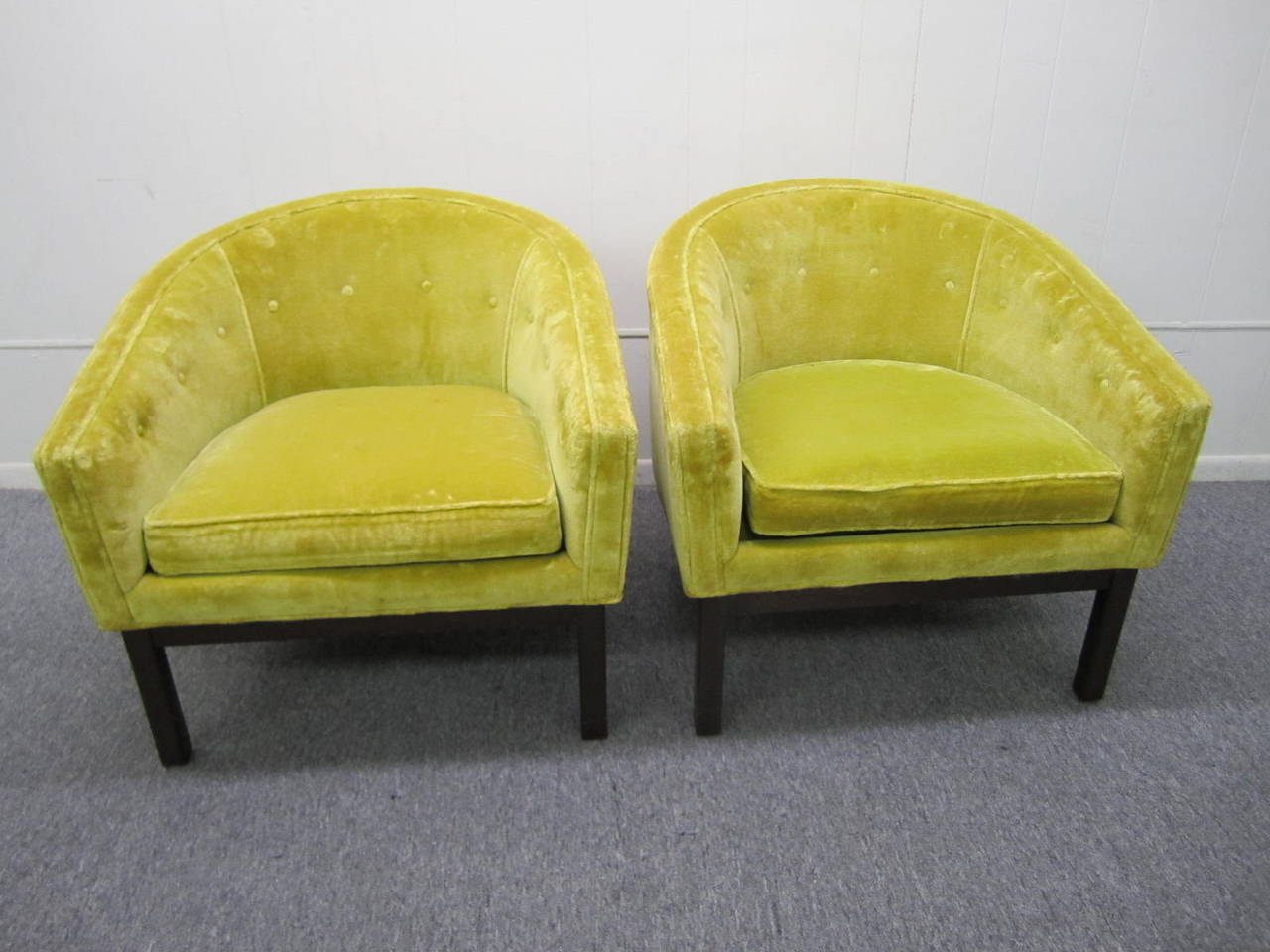 Fabulous pair of Harvey Probber style barrel back chairs.  Lightly tufted original yellow velvet upholstered seats sit on dark walnut bases.  Classic mid-century form with comfortable function.