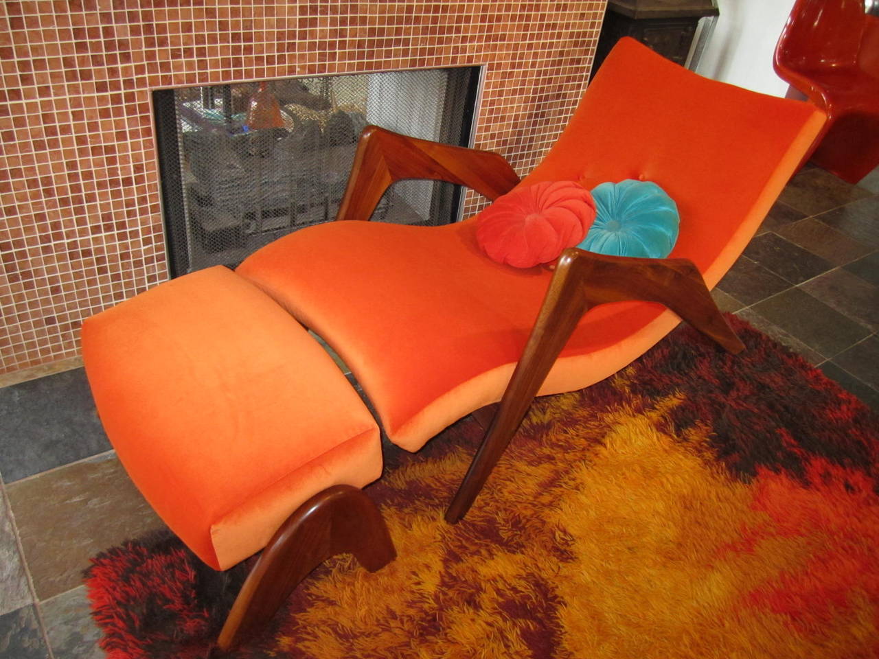 Rare and hard to find lounge chair and ottoman designed by Adrian Pearsall, sometimes call the grasshopper chair. Refinished and reupholstered in a high end citrus orange velvet. The new orange velvet fabric has a slight ombre effect-shading darker