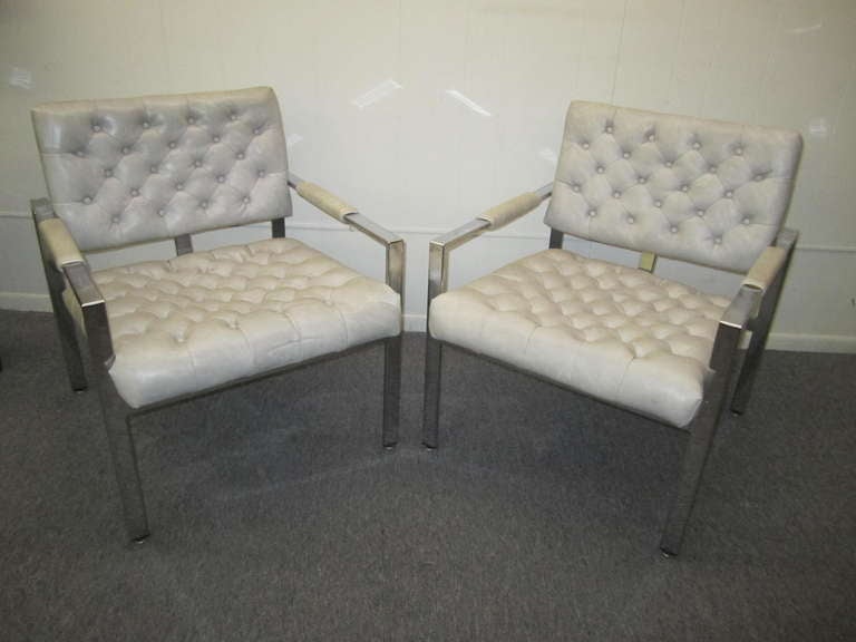 Lovely pair of Milo Baughman tufted chrome lounge chairs. These are made by Thayer Coggin and look great. Use as is or reupholstered in your customers favourite fabric-they are sure to please!