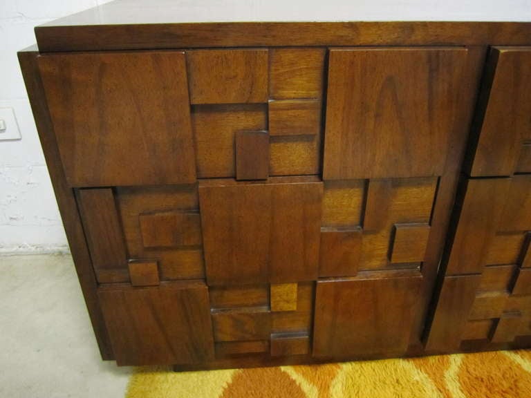 Handsome Paul Evans inspired chunky walnut mosaic credenza made by Lane.  This piece is in  very nice vintage condition and is very well made.  The top has it original finish and looks quite nice.  I have several other pieces from the same