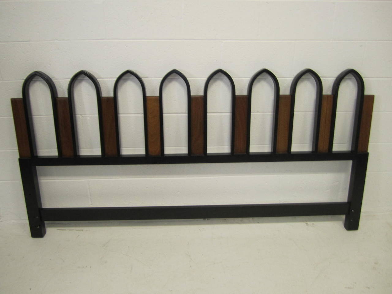 King-size headboard with ebonized walnut arches separated by natural walnut panels. Harvey Probber, circa 1950. Identically finish on reverse side so may free-stand if desired.