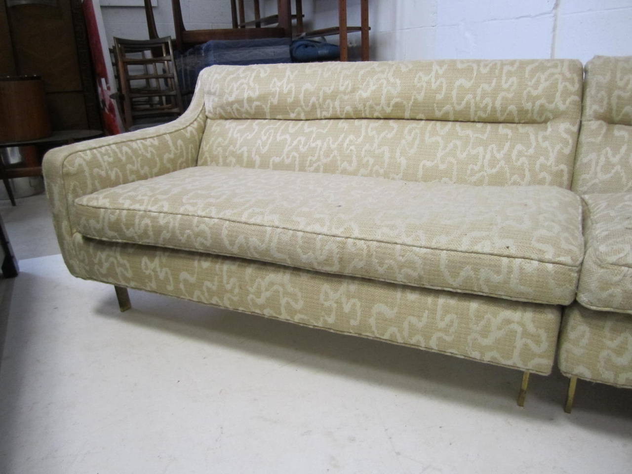 Stunning Harvey Probber style two-piece sectional with solid bronze legs. These pieces will need to be reupholstered but this set is surely worth the effort. We have never seen such fabulous solid bronze legs before just exquisite. We approximate