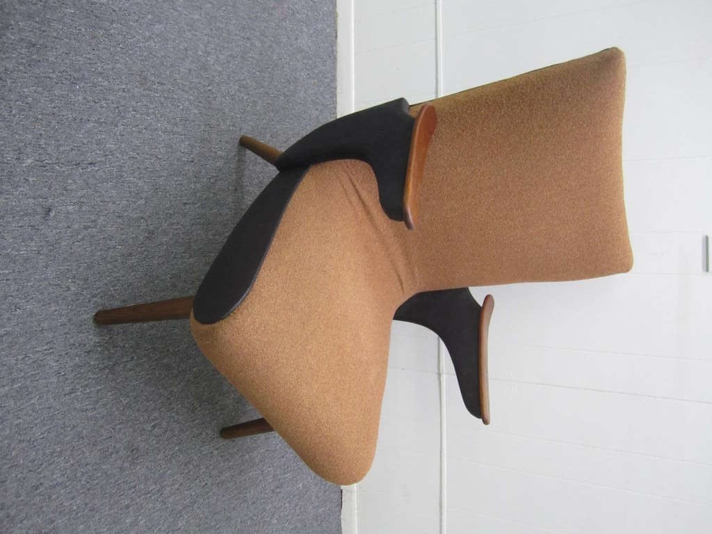 Wonderful Adrian Pearsall flipper arm lounge chair. This piece has a sculptural quality and looks like a piece of art-very stylish. Newly reupholstered in a textured leather and boucle combination.