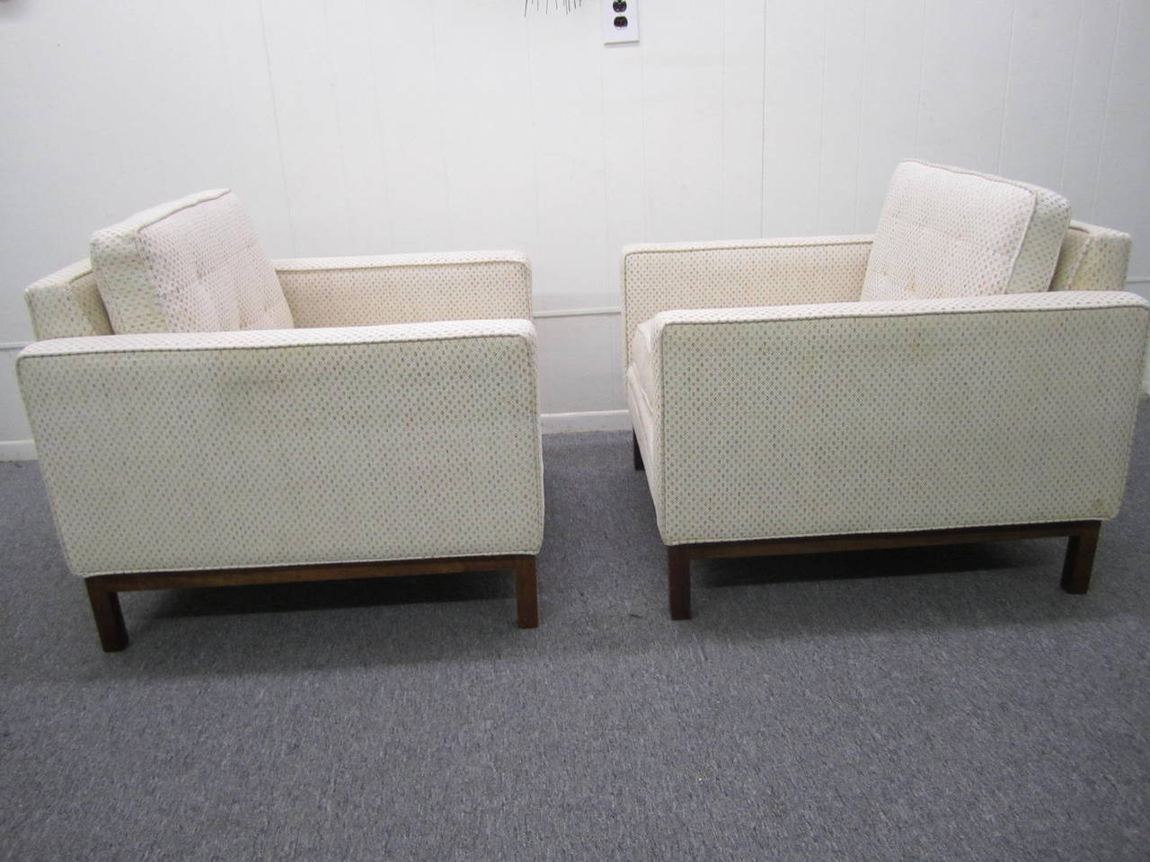 Handsome pair of Harvey Probber style upholstered cube arm chairs.  We love the solid walnut base that wraps completely around the bottom.  Great modern lines with super comfort. You and your guests will love the style and comfort of these modern