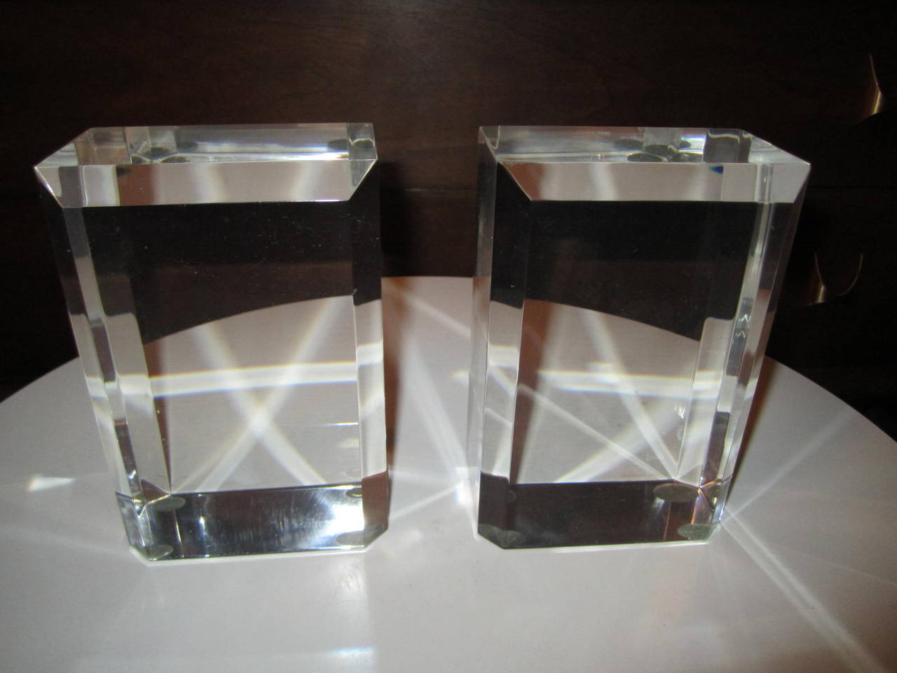 Excellent pair of Karl Springer style solid lucite block bookends.  Great faceted edges giving them a gem like quality-dazzling.
