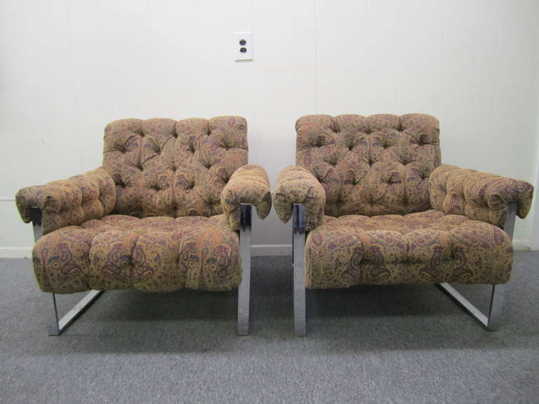 Fantastic and rare pair of tufted chrome lounge chairs.  This pair retains it original paisley velvet upholstery which is actually quite nice.  These are perfect for the designer who needs to reupholster—the other pair of these on 1stdibs is