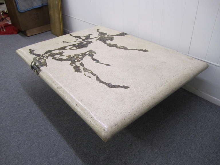 A beautiful handcrafted stone and bronze abstract coffee table by New York artist, Silas Seandel. An impressive, heavy cocktail table from Seandel's "Terra" group of cast stone pieces (this material was refined by Seandel over several
