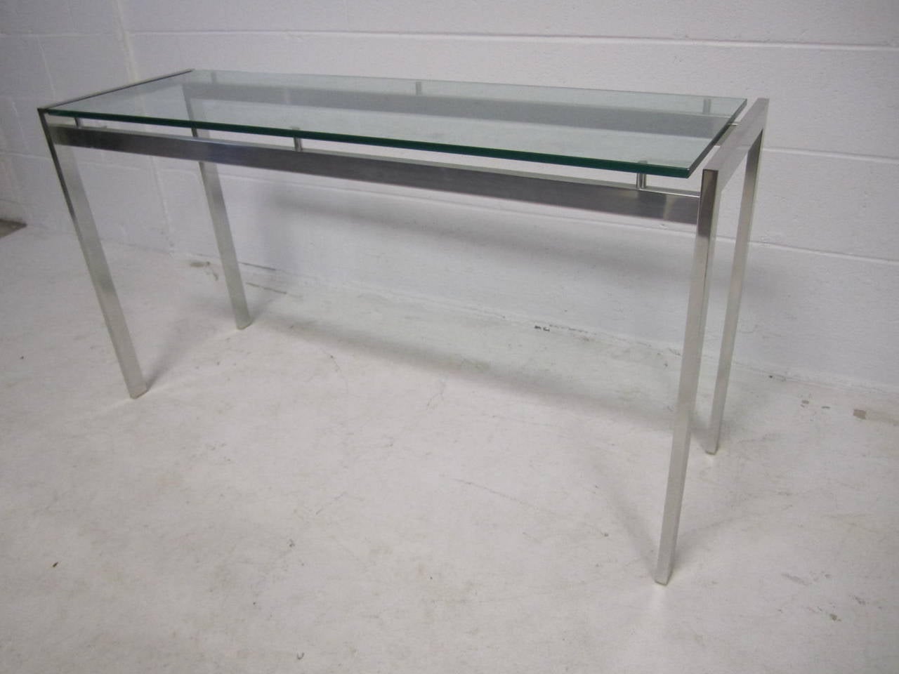 Super sexy polished aluminum long console table.