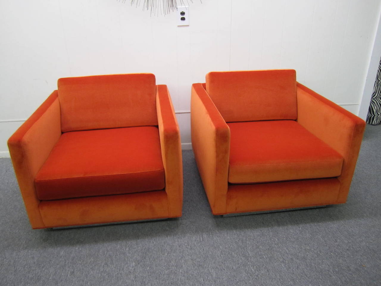 Excellent pair of totally restored signed Milo Baughman cube lounge chairs. New high end orange velvet fabric along with new foam have gone into the restoration of these amazing chairs. The plinth bases have also been re-chromed and looks fabulous.