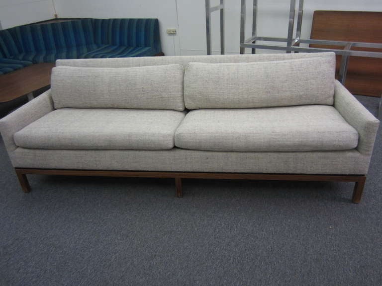 OUTSTANDING PAIR OF PROBBER STYLE MID-CENTURY MODERN SOFAS.  THIS PAIR HAS IT'S ORIGINAL HEAVY WOVEN OATMEAL UPHOLSTERY IN FANTASTIC CONDITION WITH VERY LITTLE WEAR.  THE WOODEN BASE HAS A HANDSOME BLACK DETAIL THAT GIVES THESE PIECES A CLASSIC