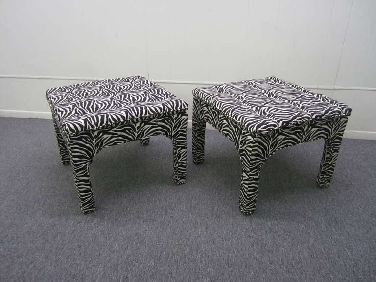 LOVELY PAIR OF MILO BAUGHMAN STYLE UPHOLSTERED ZEBRA STOOLS.  THE UPHOLSTERY IS QUITE NICE AND HIGH END.  THE FABRIC WAS DONE ABOUT 10 YEARS AGO AND STILL LOOK NEW.  THESE ARE SURE TO PLEASE AND CAN BE USED IN A MILLION WAYS.