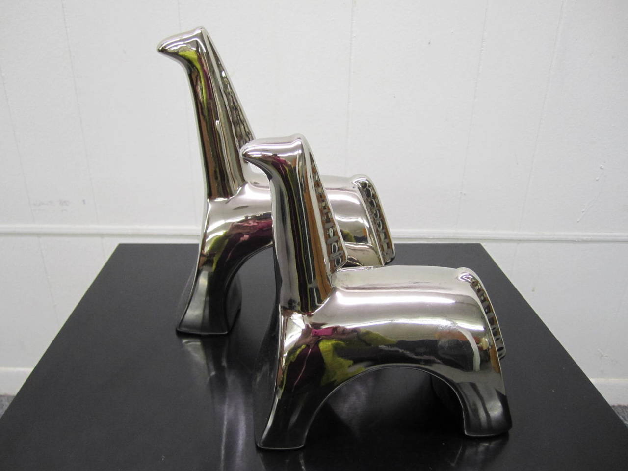 Minimalist Modern Ceramic Horses with Mirrored Metallic Glaze by California based pottery studio Jaru, c1970. Pieces are in excellent condition with normal wear.