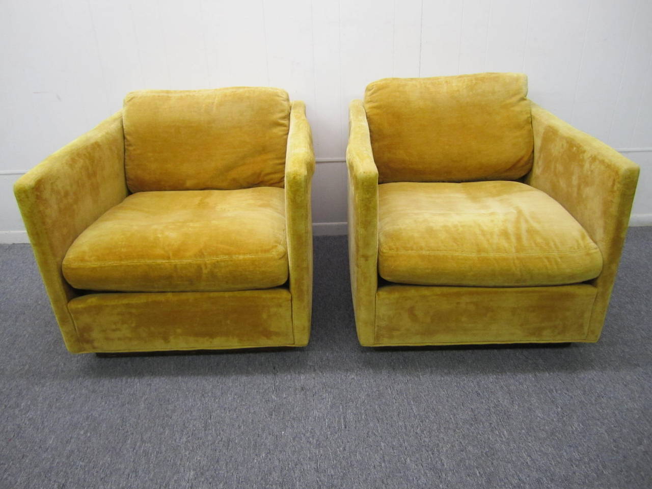 Fantastic pair of signed Milo Baughman cube lounge chairs for James Inc.  These are perfect for the designer who needs to re-upholster.  They have a wonderful walnut plinth base giving them floating appearance.  The bases can be chrome plated for a