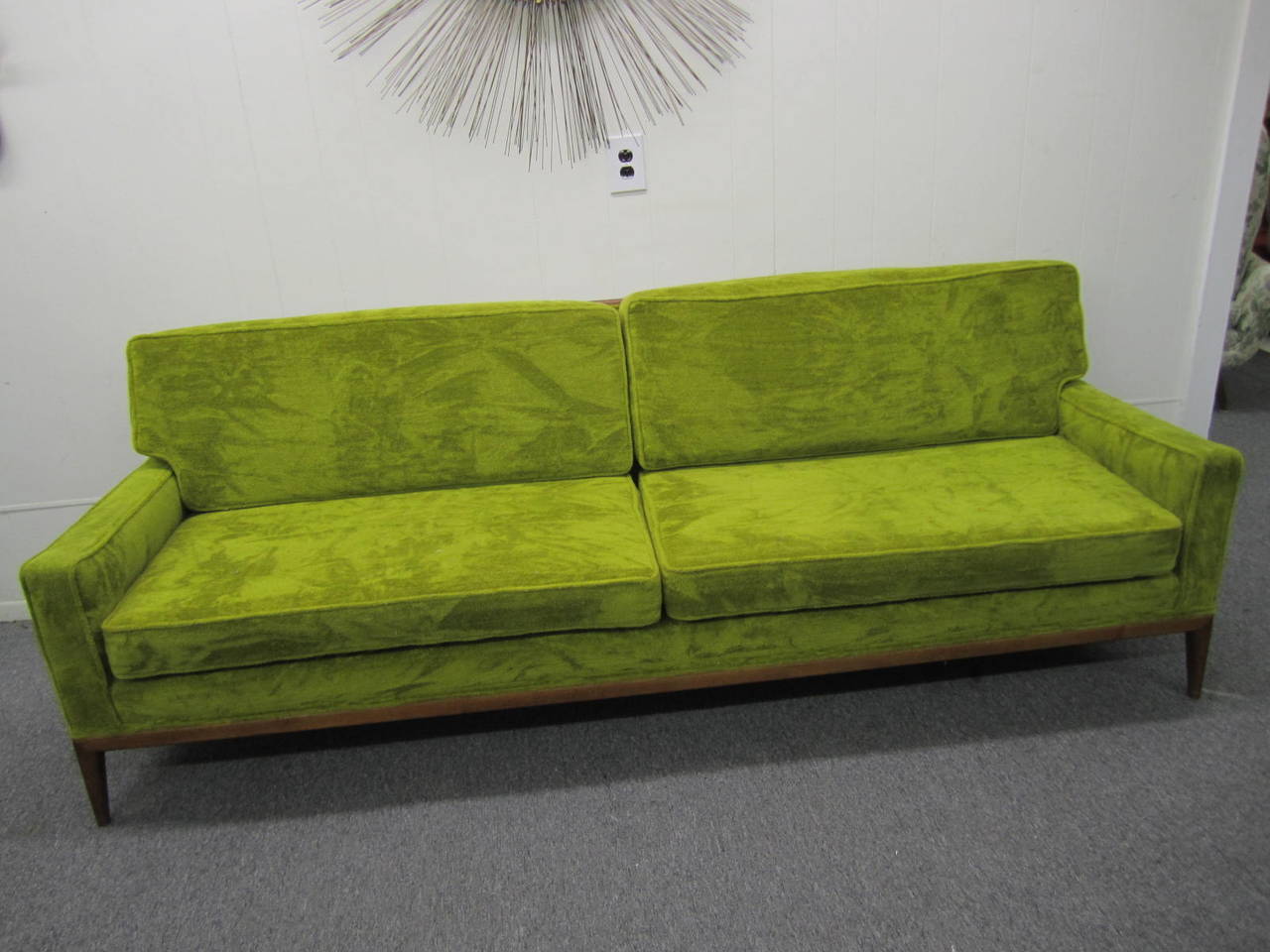 Gorgeous Robsjohn Gibbings style solid walnut framed sofa.  Handsome solid walnut encases the entire back ending in graceful tapered legs.  Fabulous looking from the front or back-place this sofa in the middle of the room for full viewing pleasure.