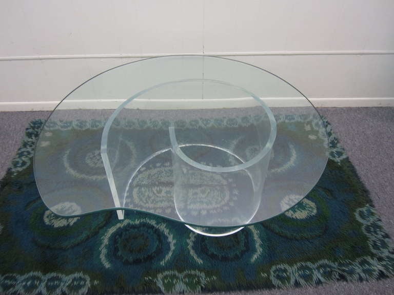 Gorgeous Thick lucite snail table with custom glass.
