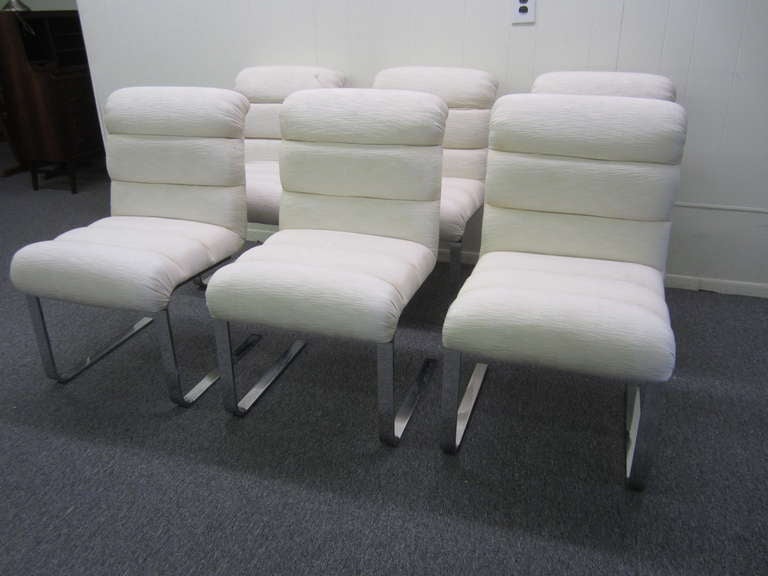 FABULOUS SET OF 6 LUGANO CHAIRS BY MARIANI FOR PACE COLLECTION.  THESE CHAIRS ARE IN GREAT CONDITION WITH THE CHROME HAVING A MIRROR FINISH.  THE FABRIC IS A BIT DATED BUT IS USEABLE AS IS.  THEY COULD STAND A GOOD CLEANING BUT OTHER THAN THESE
