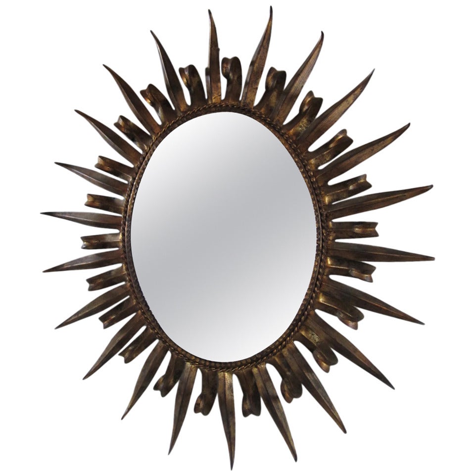 Magnifique miroir de style Hollywood Regency en or doré avec œillets en forme d'étoile, style Jere en vente