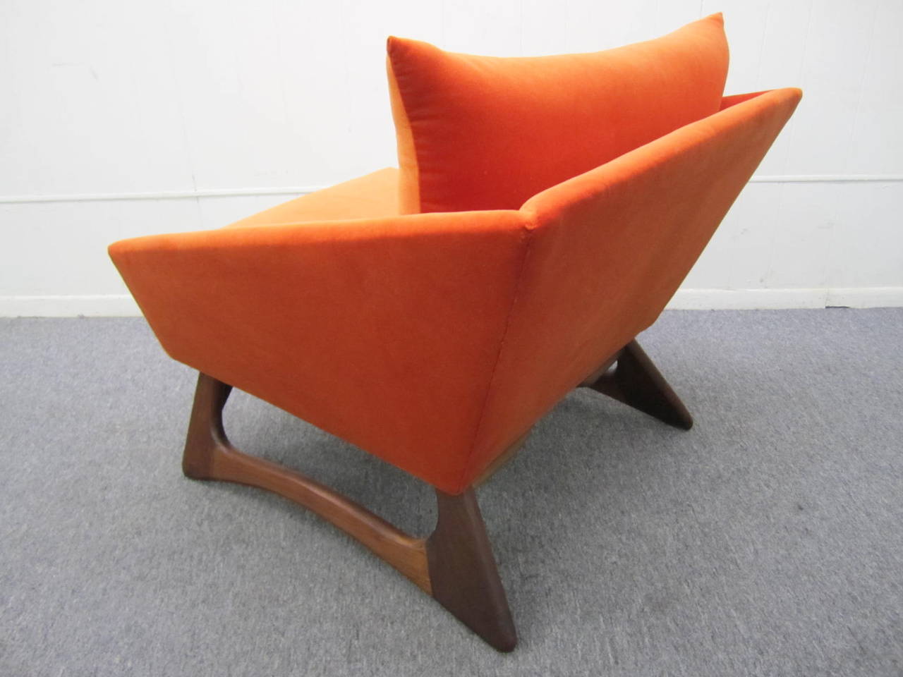 Simply scrumptious pair of Adrian Pearsall angular and sculptural lounge chair. I really feel like I can not fully describe the deliciousness of this rare pair of chairs by Mr. Pearsall. One is newly upholstered in a high-end citrus orange velvet