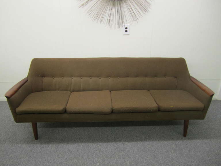  Scandinavian modern four seat sofa with sculpted teak arms and substantial solid teak legs, made by Pi Langlos Fabrikker- often attributed to Nanna Ditzel.   New Upholstery recommended.