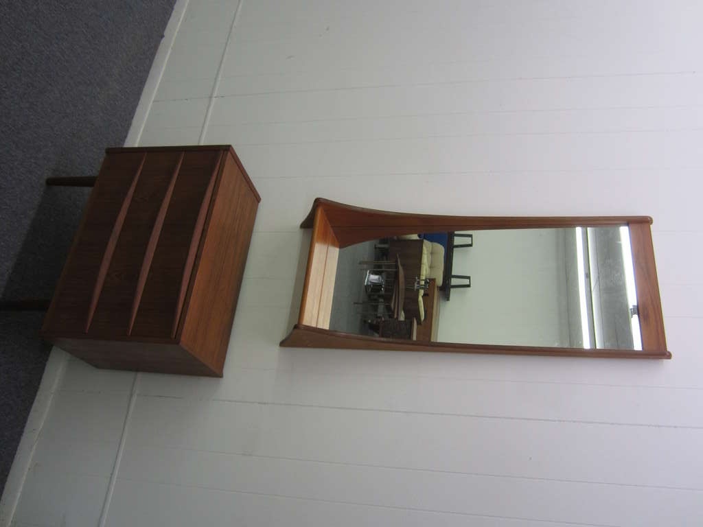 OUTSTANDING TALL DANISH MODERN TEAK ENTRY MIRROR WITH SHELF ALONG WITH A LOVELY PETITE TEAK CABINET.  THE MIRROR IS SIGNED ON THE BACK PEDERSEN + HANSEN AND THE SMALL DANISH CABINET HAS AN ILLEGIBLE DANISH STAMP.  YOU CAN SEE THAT THIS SET IS VERY