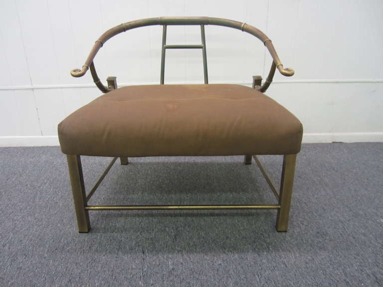 Asian-inspired Mastercraft modern lounge chair with brass frame and vintage cushions. The curved brass arms and back are faux bamboo, with horizontally scrolled handrests. Brass legs are set at an angle, square in form, and linear in contrast to the