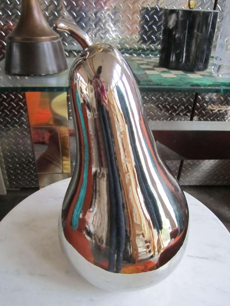 Huge Pop Art Silvertone Ceramic Pear

Fantastic silver tone ceramic pear Mid century Funky Pop Art 1960's 1970's Decor

Label on bottom has maker's name- Zanolli & Sebellin

By well known & celebrated artist in Italy, POMPEO