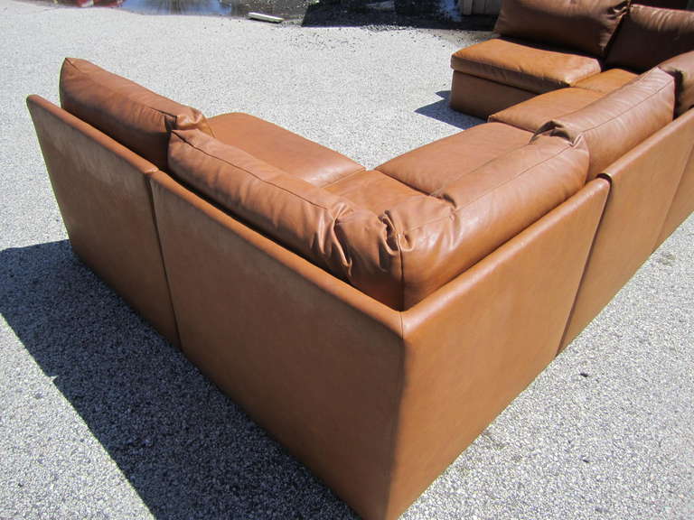 Fabulous signed Milo Baughman Faux leather sofa with 6 modular pieces.  This set includes 2 corner sections and 4 slipper sections and can be arranged in many different configurations.  Only one Milo label has survived but there are several Thayer