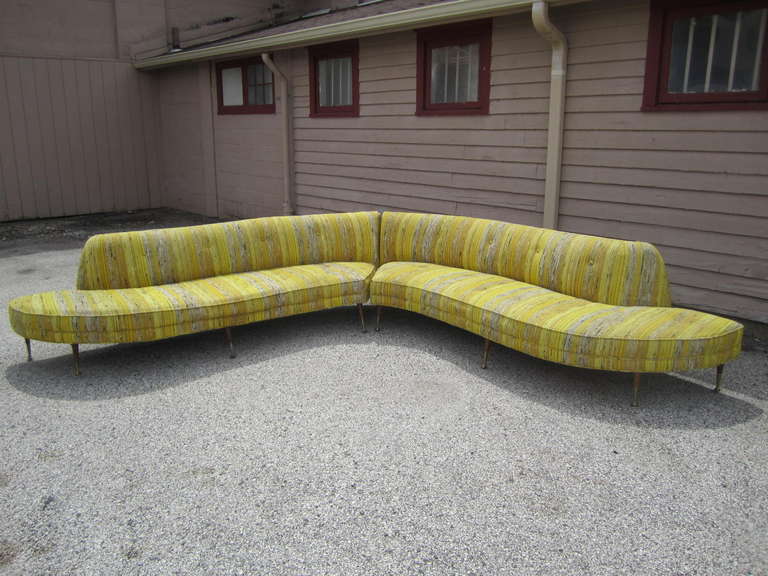 Over the top gorgeous Vladimir Kagan style 2 piece serpentine sofa.  Amazing is not descriptive enough to describe this mid-century masterpiece.  Just look at the wonderful brass and walnut legs-very sexy. Each sofa measures 28
