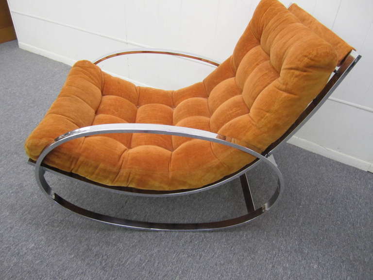 Milo Baughman style flat bar chrome rocker with it's original orange velvet fabric, great form and one of the hippest modernist rockers around. The chrome frame has a nice mirrored finish.