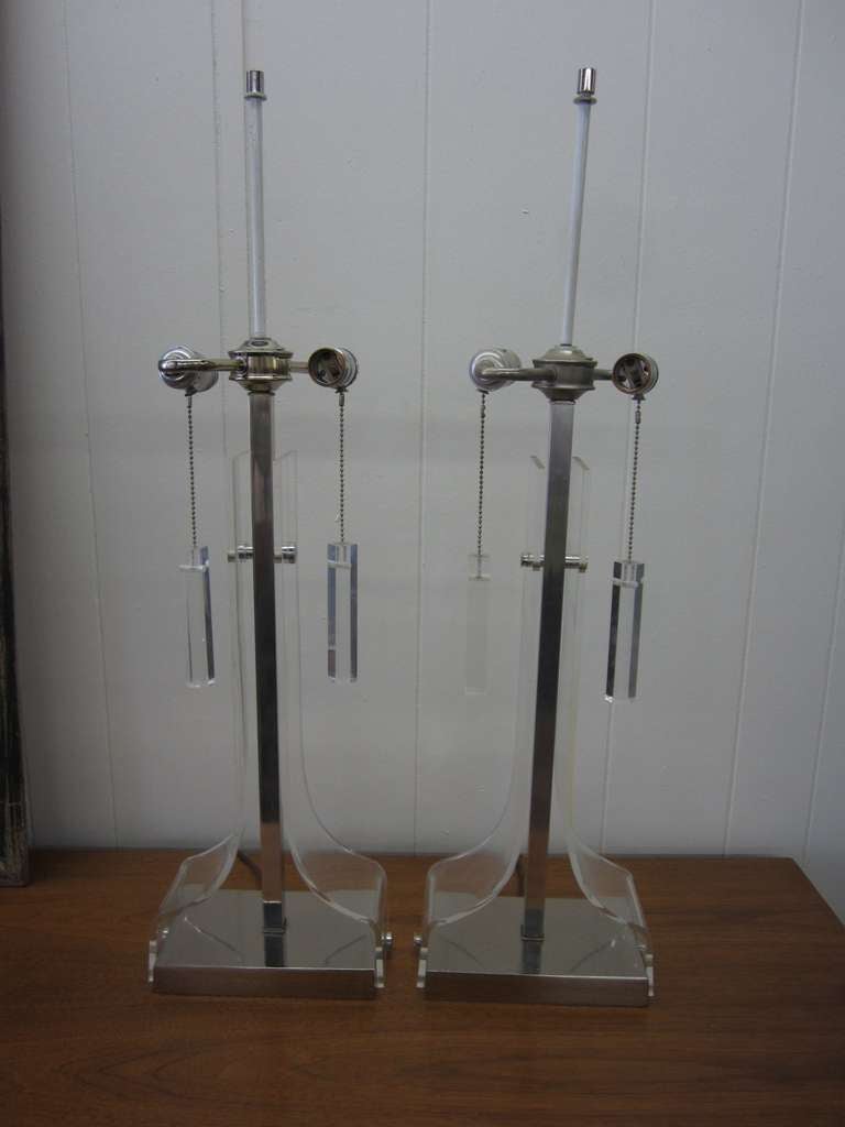 Wonderful pair of lucite and chrome Laurel lamps.  