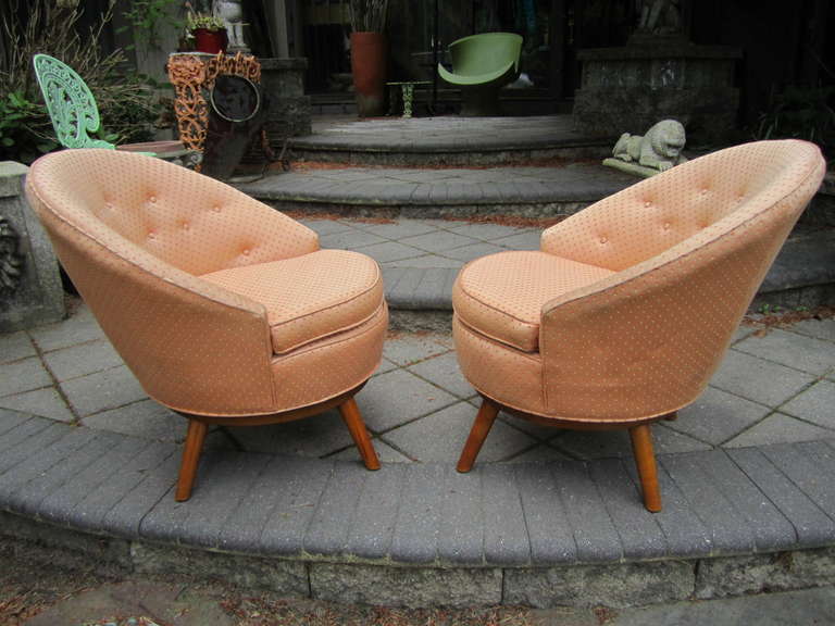 Excellent pair of Conant Ball peacock back swivel chairs.  Wonderfully designed chairs that are as comfortable as they are great looking.