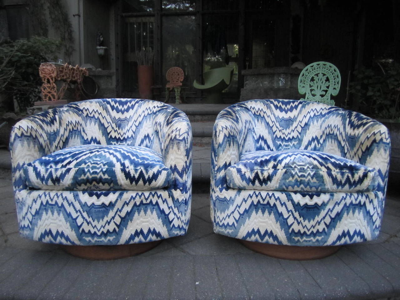 Simply gorgeous pair of signed Milo Baughman swivel rocker chairs. The original thick cut velvet fabric is uniquely stunning. The vintage fabric show some minor wear to one arm and one-light stain on side-see photos. I actually do not mind the tiny