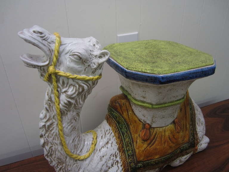 Whimsical and decorative glazed terra cotta camel garden seat. this piece is Quite large and impressive in person.