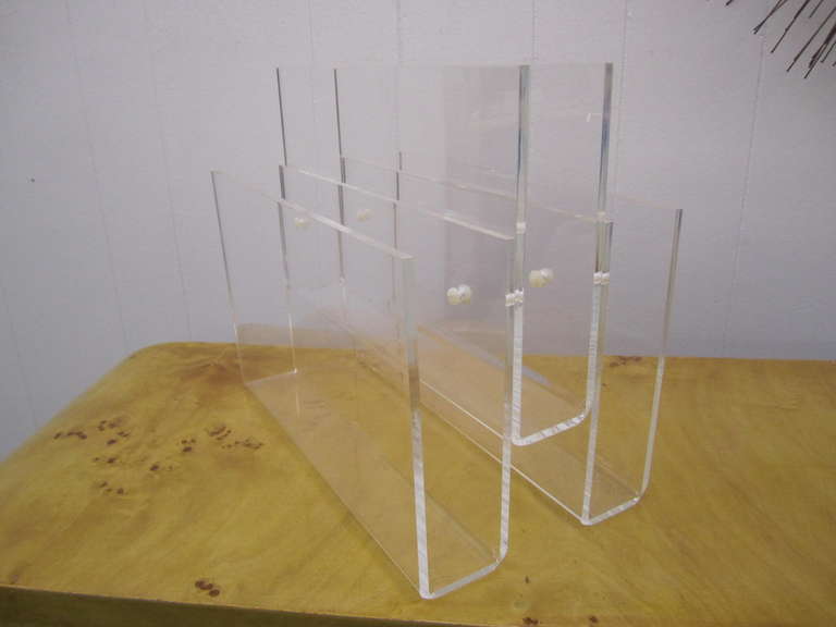 Lovely mid-century modern thick lucite magazine rack.  This piece is in very nice vintage condition with only some light scratches.  The lucite is thick and is clear with no crazing.
