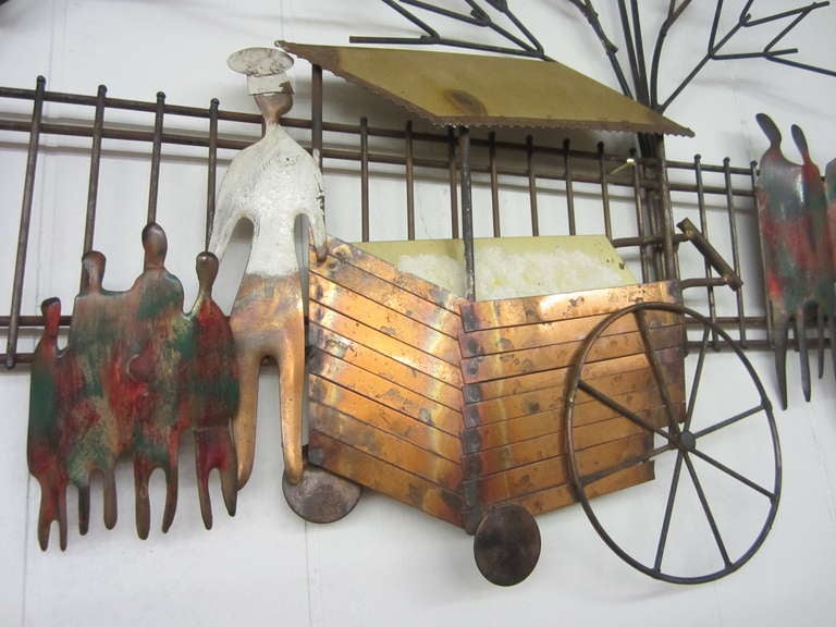 Charming Jere style mixed metal outdoor bakery cart wall sculpture.  This wonderful sculpture is signed Wiley.  I love the outdoor scene with the bakery cart and baker ,winter time trees and fun groups of pedestrians.  
