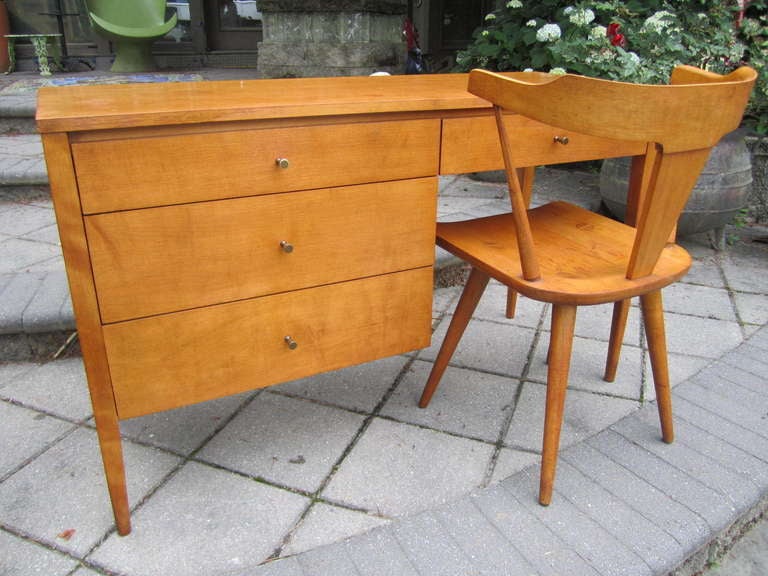 Lovely Paul Mccobb Planner Group desk with a matching chair.  This desk is in nice vintage condition.  The desk and chair shows some minor wear which gives it authenticity and vintage appeal.  I know there are some who like to see a bit of wear-just