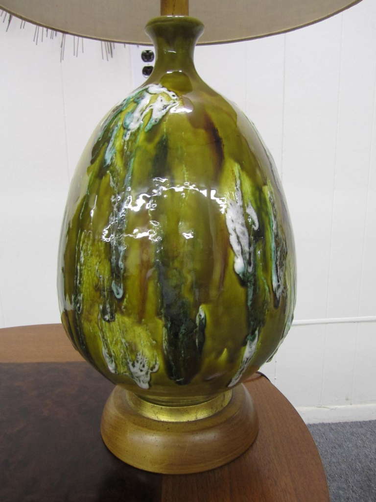 Awesome huge green thick drip glaze table lamp.  This lamp is really big standing at 42"t total including its original barrel lamp shade.  This gorgeous lamp command attention with its textured thick dripped glazing and large bulbous size.  I