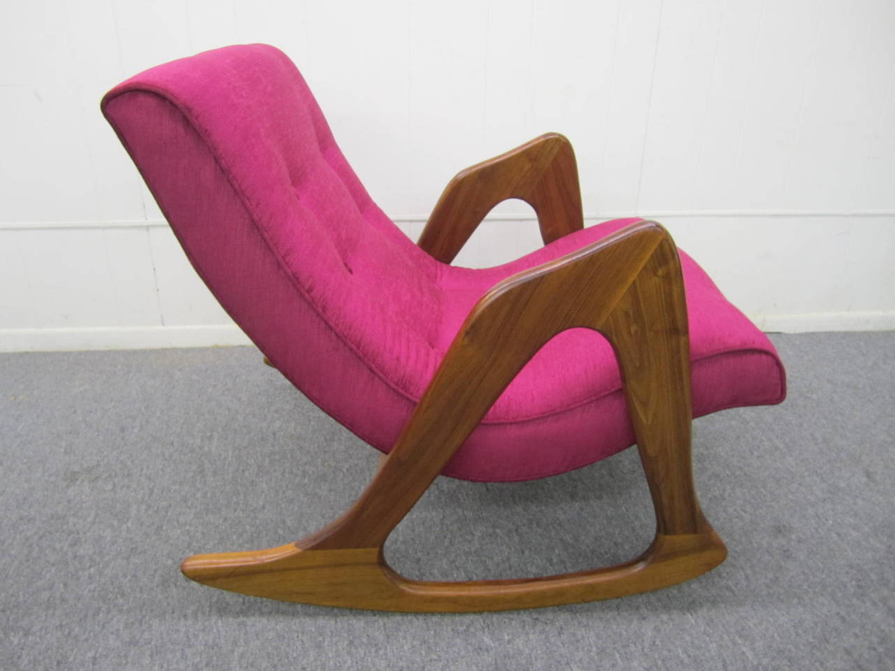 Spectacular Adrian Pearsall walnut rocking chair for craft associates. This fabulous sculptural rocker is in great vintage condition. The high end raspberry velvet upholstery and foam are brand new. The base retains its vintage finish in nice