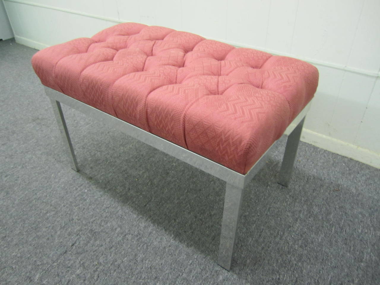 Lovely Milo Baughman style tufted bench with an aluminum frame.  The seat cushion is very comfortable and stylish-would look great in front of a vanity or makeup station.  We love the mellow patina the aluminum base has acquired-great vintage vibe.
