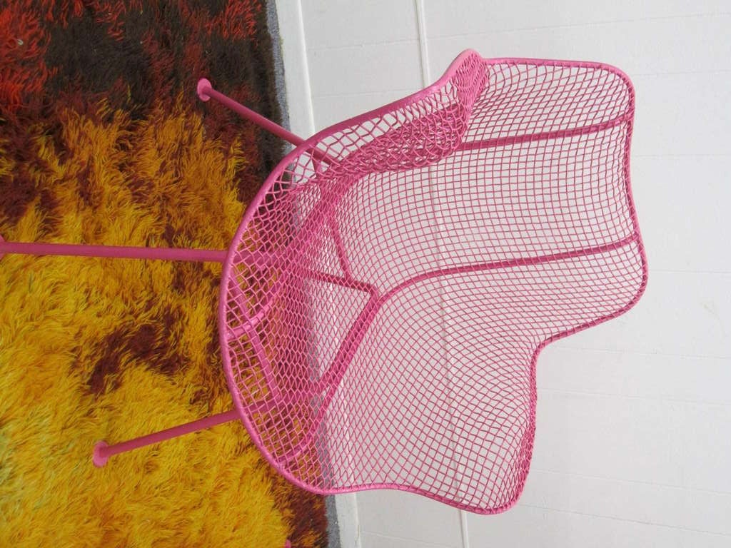 Super fun pair of hot pink Woodard Sculptra mesh patio chairs.  This lovely pair have been freshly painted in 4 coats of hot pink rustoleum.  These will be amazing next your mid-century modern pool or on your terrace.