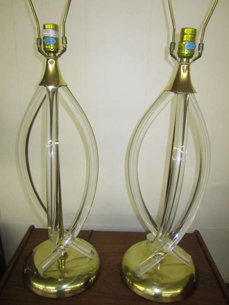 Stunning pair of Dorothy Thorpe lucite and brass lamps. Gorgeous vintage condition-the lucite is clear and the brass has a mellow patina.