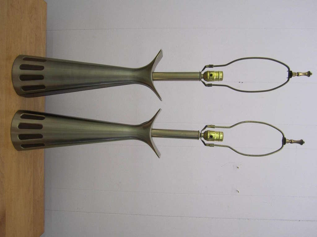 Lovely pair of mid-century  modern brushed brass laurel lamps with walnut details.