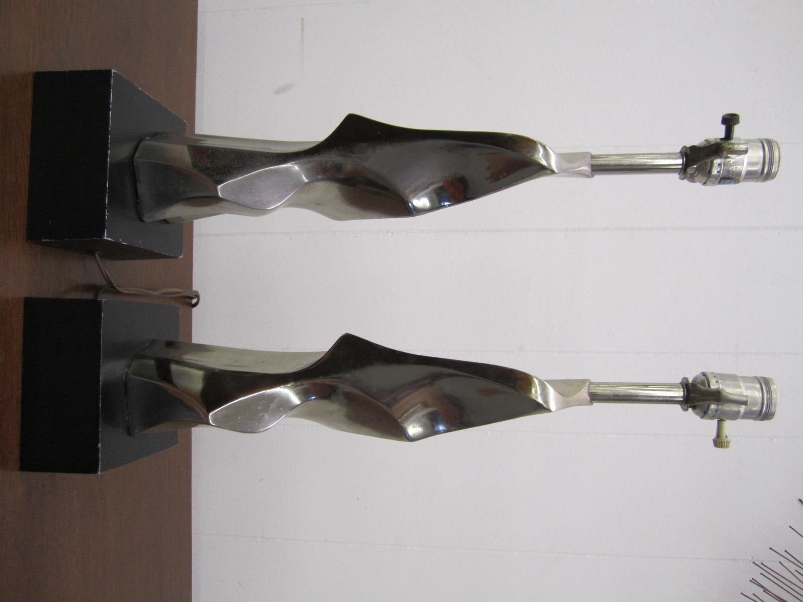 Fabulous pair of Brutalist form sculptural chrome lamps. These lamps are in very nice vintage condition retaining their original finish. Please see our huge selection of other lamps made by one of the greatest lamp company of the Mid-Century, Laurel