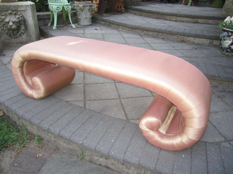 Gorgeous hollywood regency upholstered scroll bench. This piece retains it's original dusty pink raw silk upholstery and still looks great.  You will love the quality and craftsmanship of this dynamite upholstered bench.